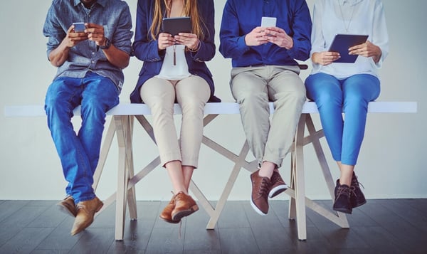 byod-dont-get-bored-while-you-wait-studio-shot-group-unrecognizable-businesspeople-using-wireless-technology-while-sitting-line-against-grey-background
